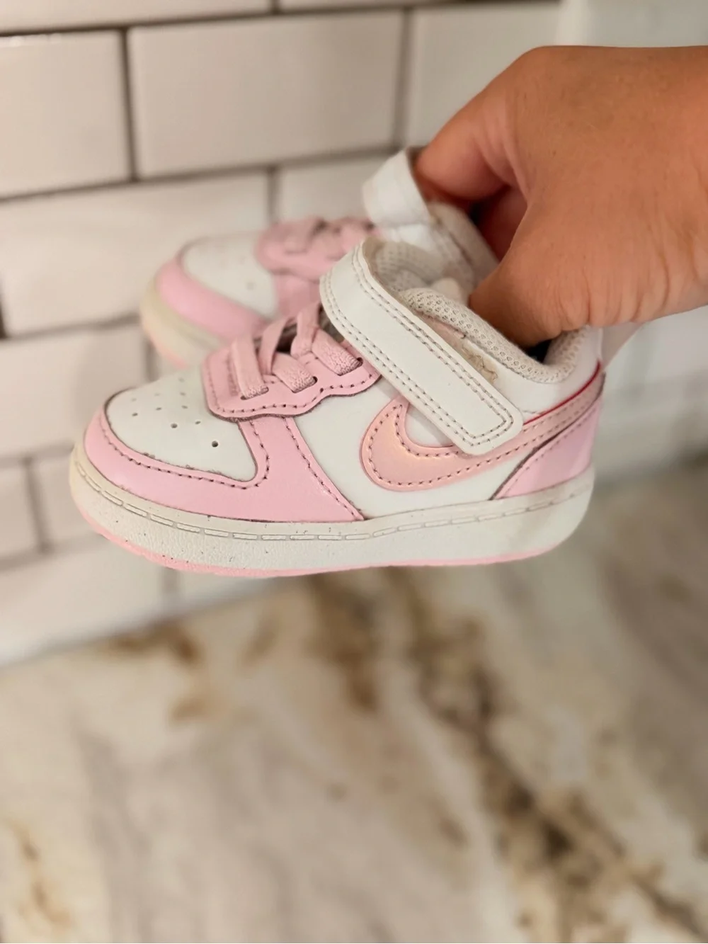 Kids Pink and White Nike shoes